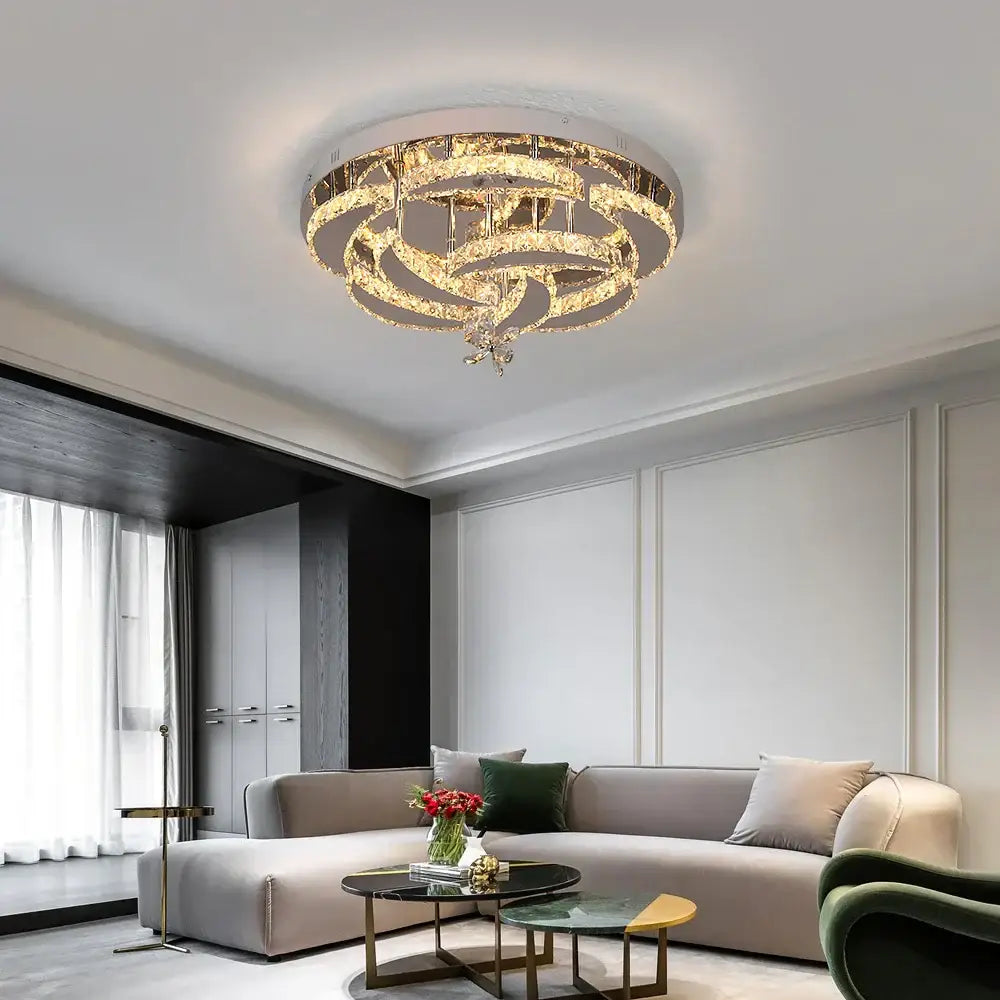 A modern decorbites crystal chandelier with concentric clear crystal rings and gold metal accents for living rooms