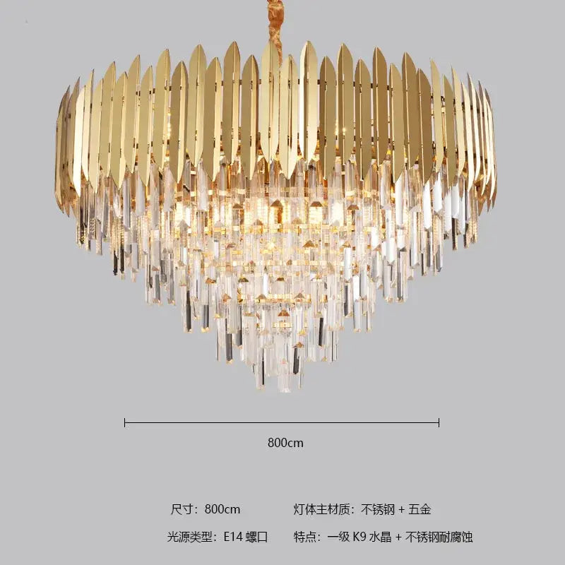 Gold-toned decorbites crystal chandelier with cascading clear crystal prisms and polished metallic blades for modern interiors