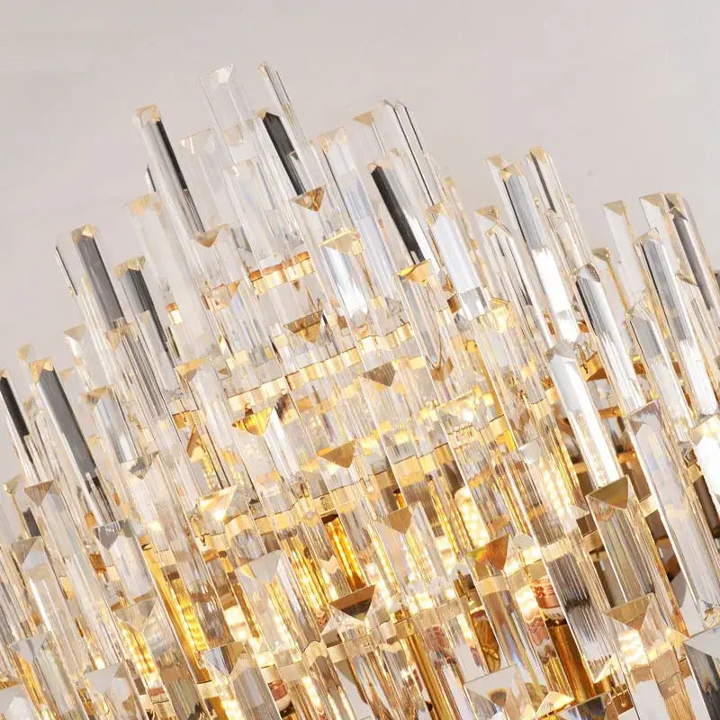 A decorbites crystal chandelier with cascading clear crystal prisms and gold-toned metal accents for modern rooms