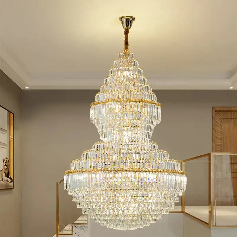DecorBites crystal chandelier featuring multi-tiered gold-toned metal and clear glass prisms for modern living rooms