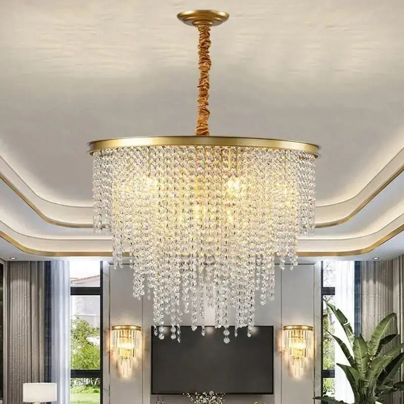 A luxuriously gold-toned decorbites crystal chandelier with cascading clear crystal droplets for modern elegance