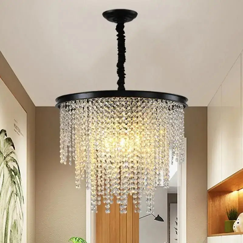 Black metal decorbites crystal chandelier with cascading clear crystal droplets for modern living and dining spaces