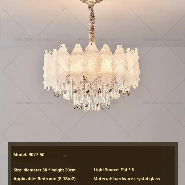 Elegant decorbites crystal chandelier with white leaf-shaped crystals and gold-toned finish for modern elegance lighting