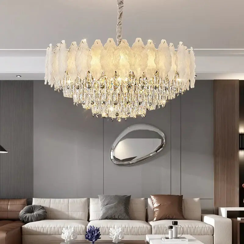 Decorbites crystal chandelier with circular design featuring white glass feathers and clear crystal droplets for modern elegance
