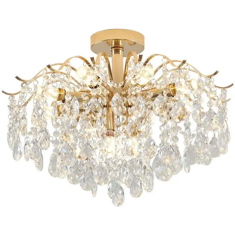 Gold-finished decorbites crystal chandelier with cascading teardrop crystals and ornate curved arms for elegant living spaces