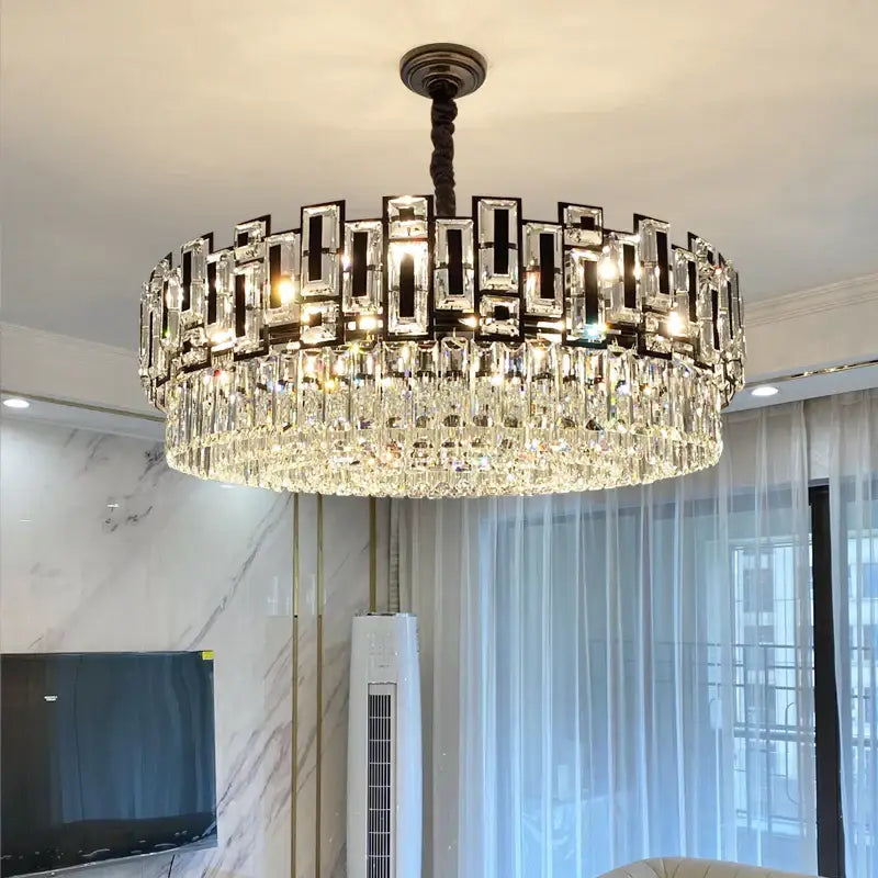 A modern geometric decorbites crystal chandelier with dark metal frame and cascading clear crystals for elegant lighting