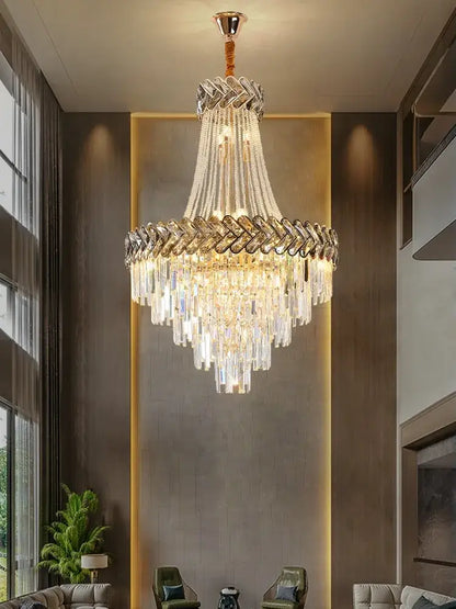Decorbites crystal chandelier with a gold-toned frame and clear glass prisms for modern european villa stair lighting