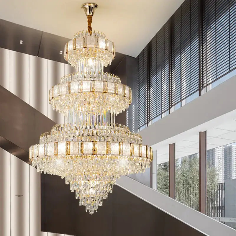 Decorbites crystal chandelier with gold-toned accents and cascading clear crystals for loft villa staircase lighting