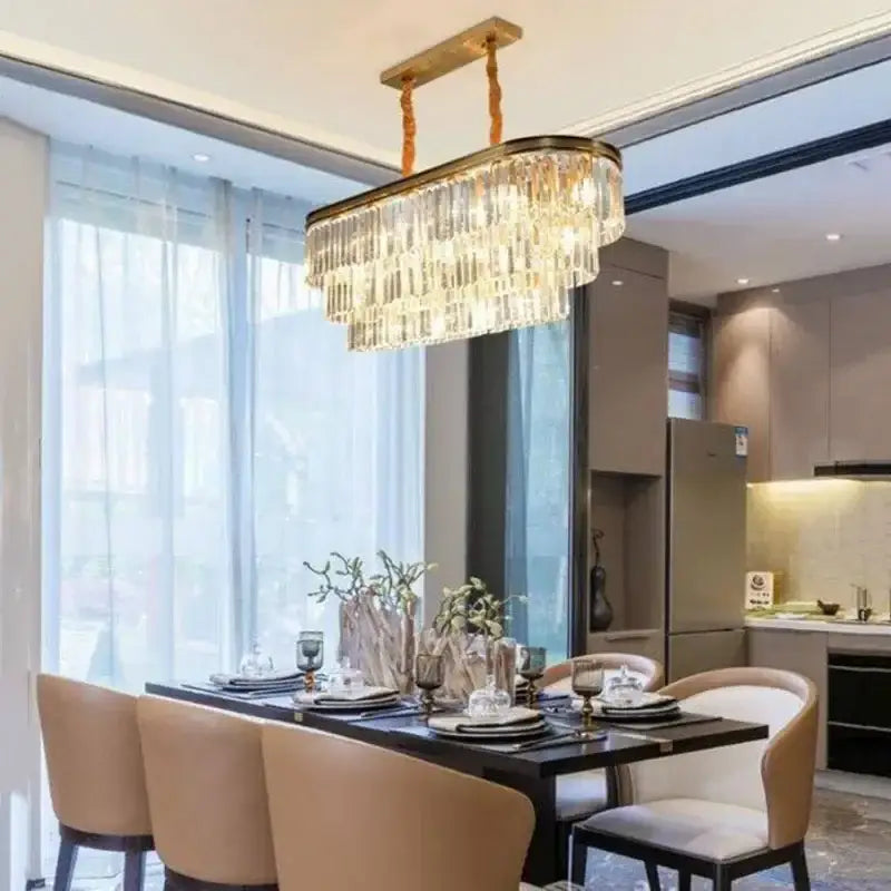DecorBites crystal chandelier with a gold-toned metal frame and cascading clear crystals for modern LED lighting