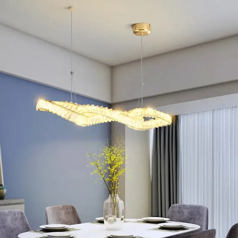 Golden modern infinity-shaped decorbites crystal chandelier pendant light with textured crystal design for dining and living room