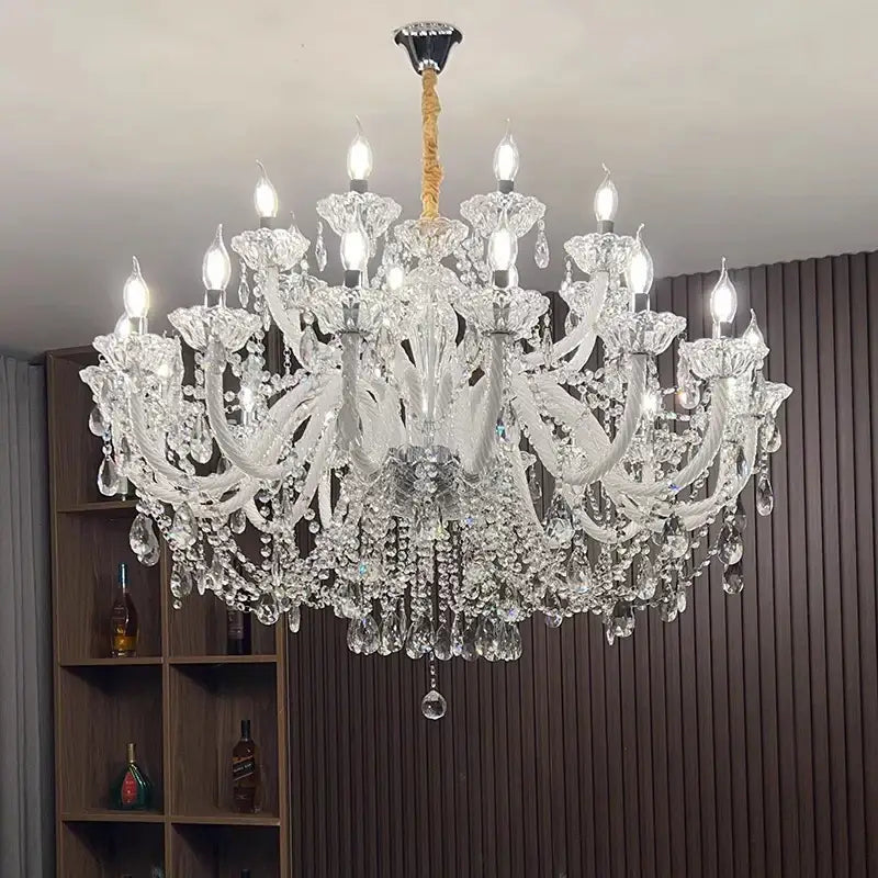 A decorbites crystal chandelier with intricate curved arms and dangling teardrop crystals for living and dining rooms
