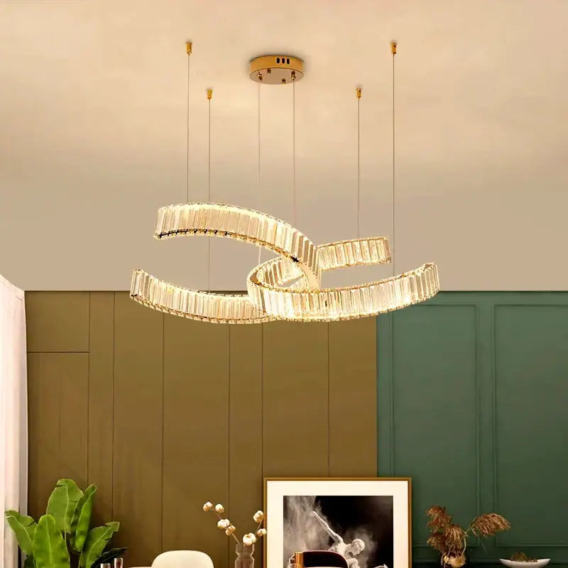 Gold-toned DecorBites crystal chandelier pendant light featuring interlocking crystal rings for modern home and dining room