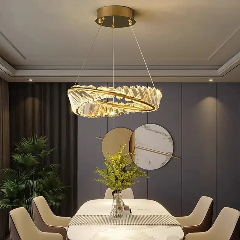 DecorBites crystal chandelier with gold-toned metal frame and clear crystals for modern living and dining room lighting
