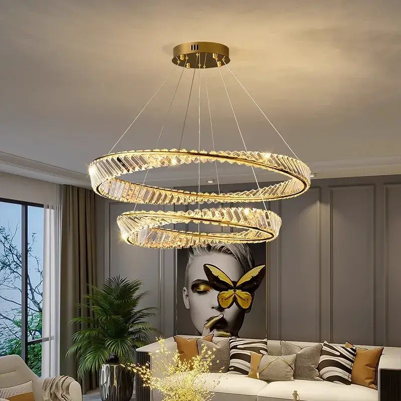 Gold-toned double-ring decorbites crystal chandelier with faceted crystal accents for modern living and dining rooms