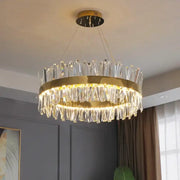Decorbites crystal chandelier with gold-toned metal frame and clear crystal prisms for modern living room lighting