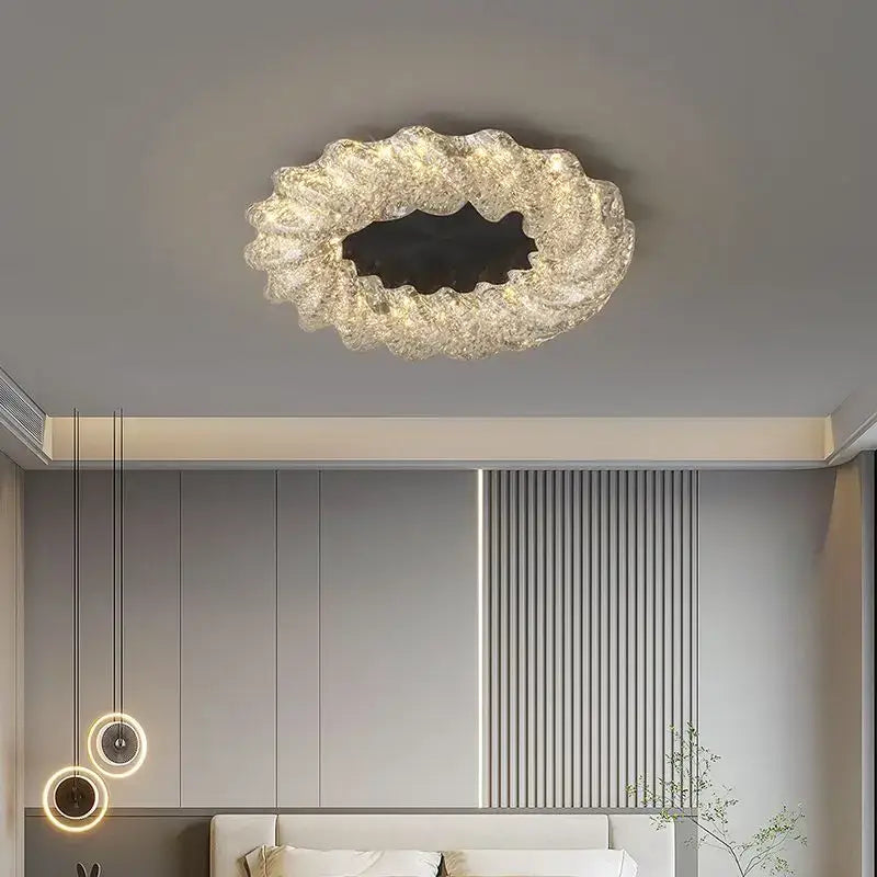 A modern translucent decorbites crystal chandelier with scalloped design and warm ambient lighting for home and hotel décor