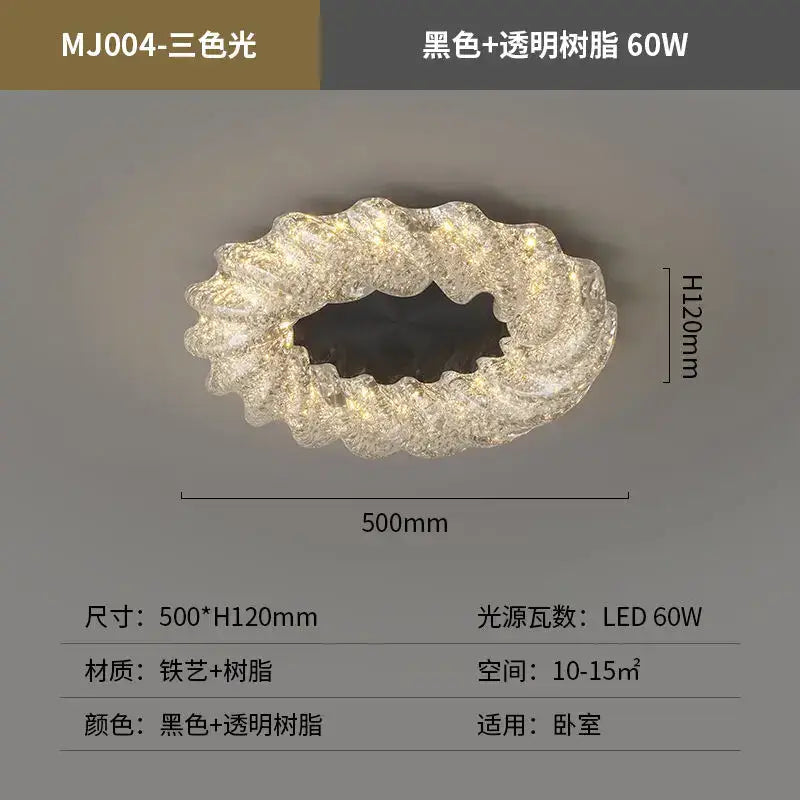 A modern oval decorbites crystal chandelier with black and transparent resin and warm LED illumination for home and hotel décor