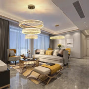 Three-tiered decorbites crystal chandelier with modern circular design and warm golden LED lighting for luxurious spaces