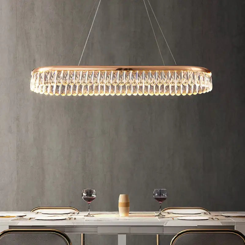 Modern oval decorbites crystal chandelier with rose gold frame and clear crystal droplets for luxurious living rooms
