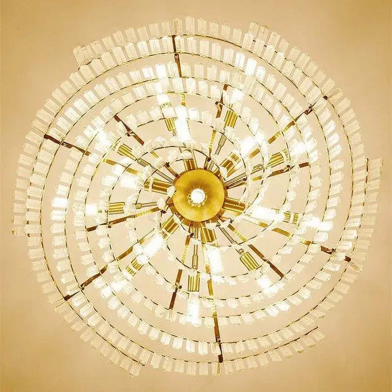 Decorbites crystal chandelier with multiple tiers of clear crystal prisms and brass accents for living room lighting