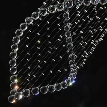A decorbites crystal chandelier with clear faceted beads strung on wires for modern villa staircase lighting