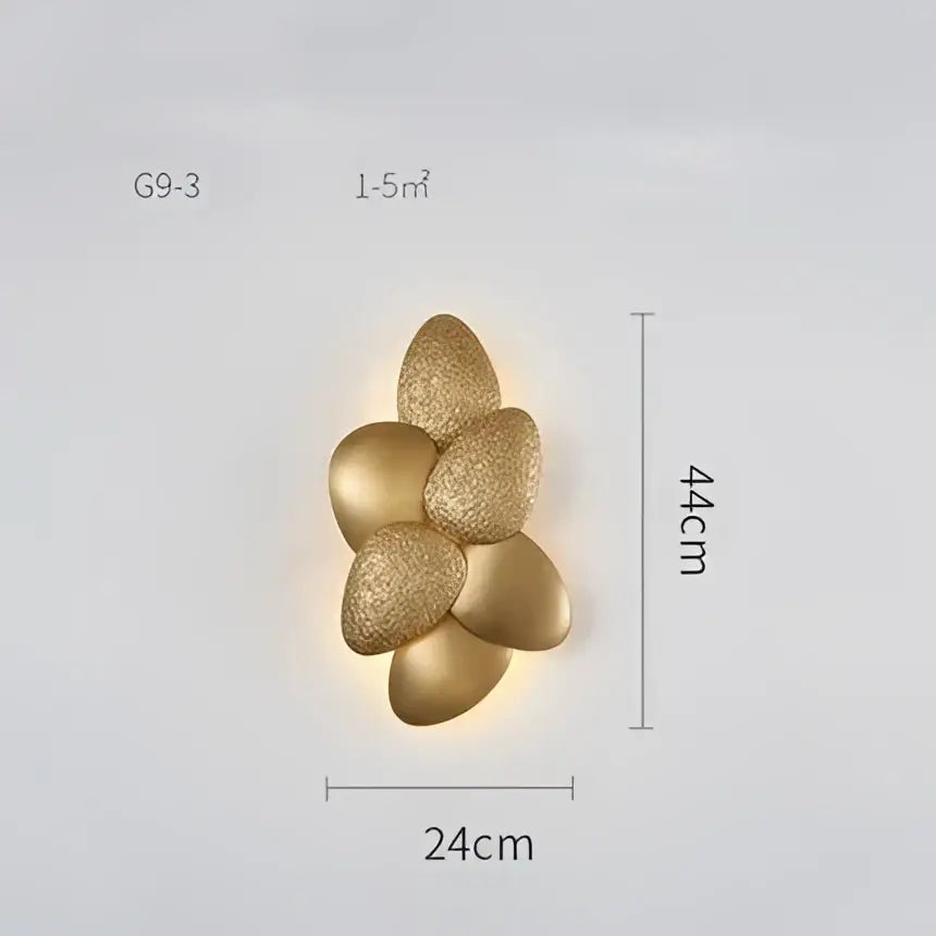 Gold-colored textured flower-shaped wall sconce with modern design complementing decorbites crystal chandelier decor