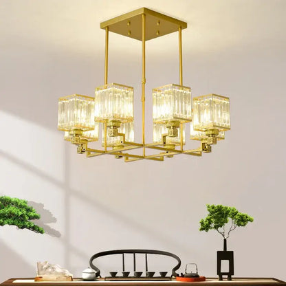 Gold-toned decorbites crystal chandelier with clear ribbed glass cubes suspended from a square frame for luxury lighting