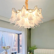 DecorBites crystal chandelier is a delicate white glass with scalloped petals and pearl accents for modern luxury lighting