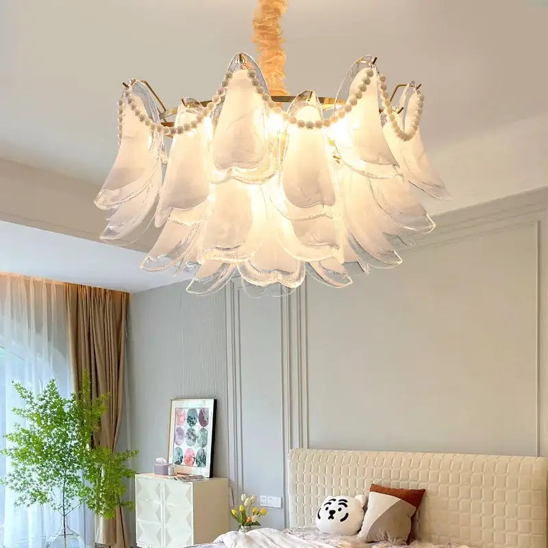 Elegant white glass decorbites crystal chandelier with pearl accents and gold-toned frame for modern luxury interiors