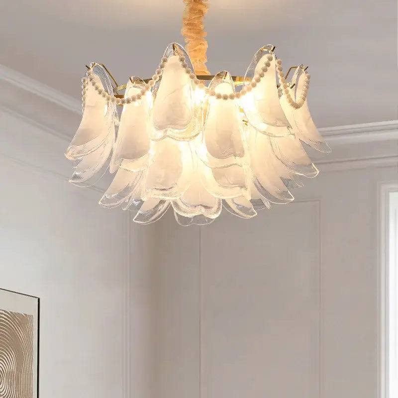 Elegant white DecorBites crystal chandelier with pearl accents and gold-toned metal frame for modern luxury lighting