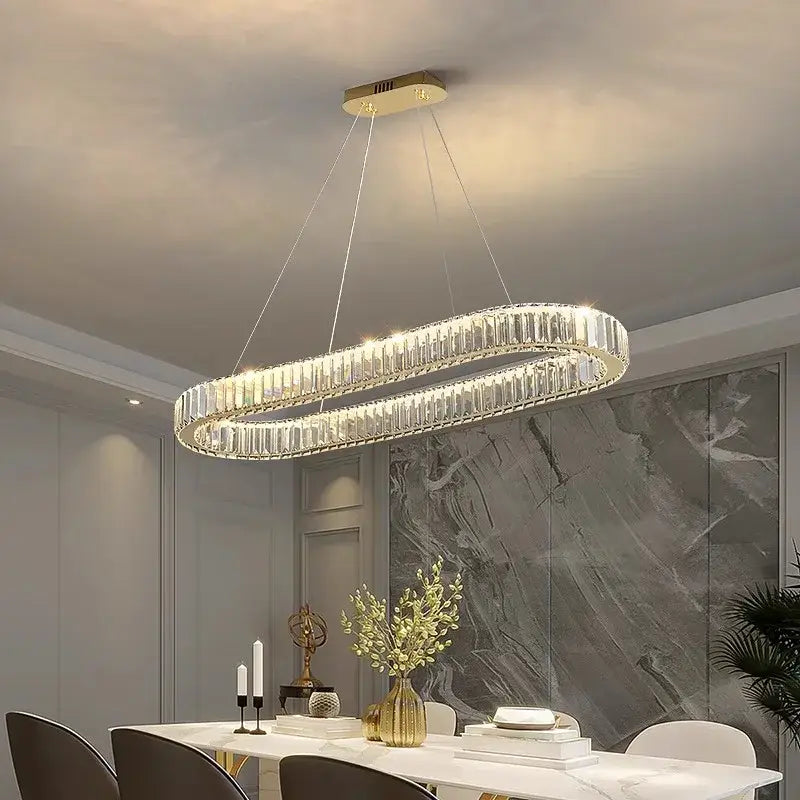 Decorbites crystal chandelier with gold-toned mount and crystal prisms for modern living and dining room lighting