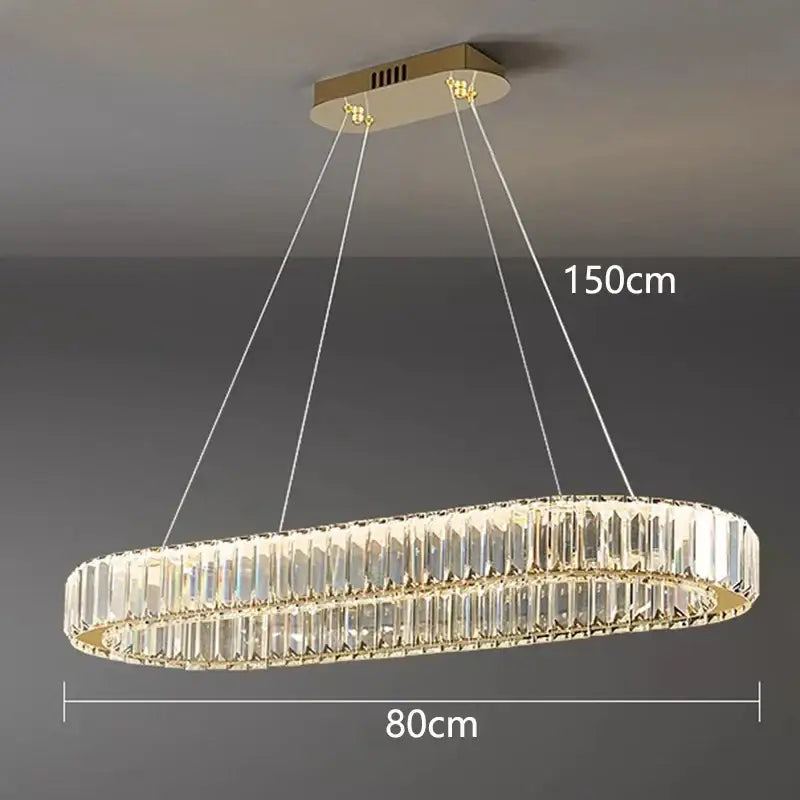 Gold-toned decorbites crystal chandelier with two concentric rings of faceted crystals for living and dining rooms