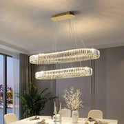 Modern double-ring decorbites crystal chandelier with clear crystal rods and gold-toned ceiling mount for living room