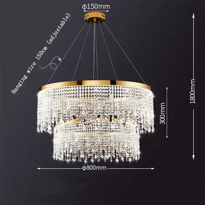 Gold-toned two-tier decorbites crystal chandelier with cascading clear crystal droplets and circular brass frame for modern spaces