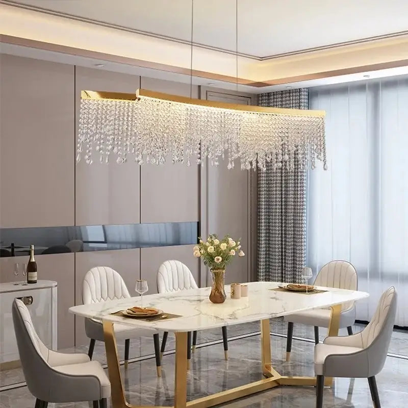 Gold-toned decorbites crystal chandelier with cascading crystal droplets for modern living room and kitchen lighting