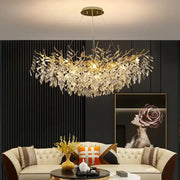 Gold-toned decorbites crystal chandelier with intricate crystal leaf and branch design for living room and hotel use