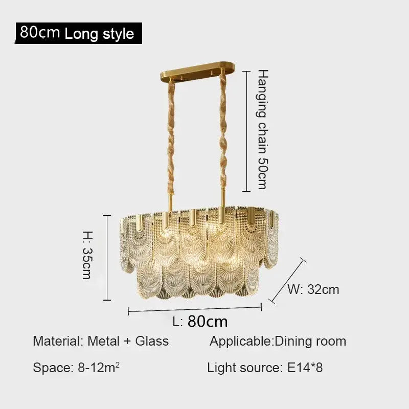 Gold-toned decorbites crystal chandelier with cascading fan-shaped glass panels suspended from twisted metal chains
