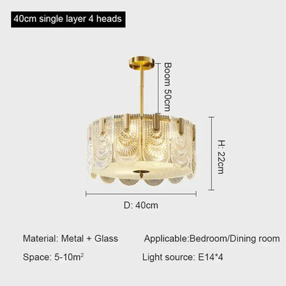Gold-toned decorbites crystal chandelier with four glass shades featuring fan-like patterns for modern luxury lighting