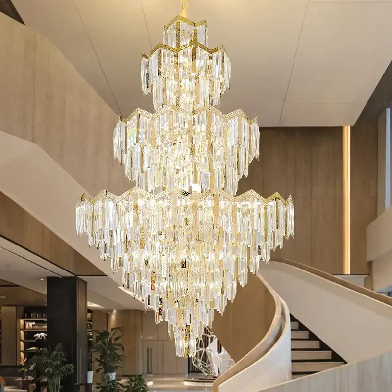 A decorbites crystal chandelier with gold-toned metal accents and clear glass prisms for modern luxury spaces