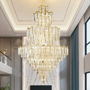 DecorBites crystal chandelier with cascading clear crystal prisms and gold-toned metal for luxury villas and hotels