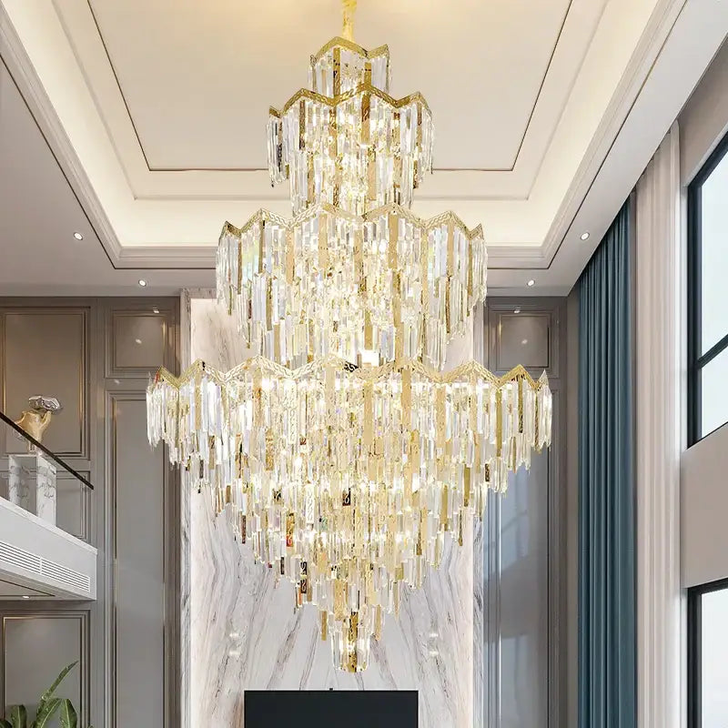 DecorBites crystal chandelier with cascading clear crystal prisms and gold-toned metal for luxury villas and hotels