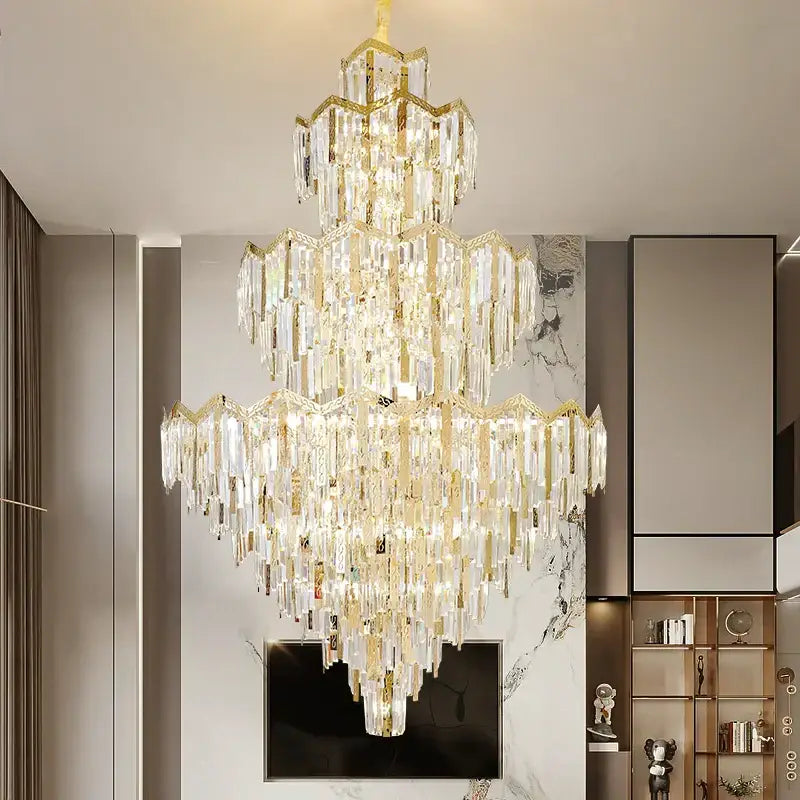 A decorbites crystal chandelier with cascading clear prisms and gold-toned metal frame for modern luxury spaces