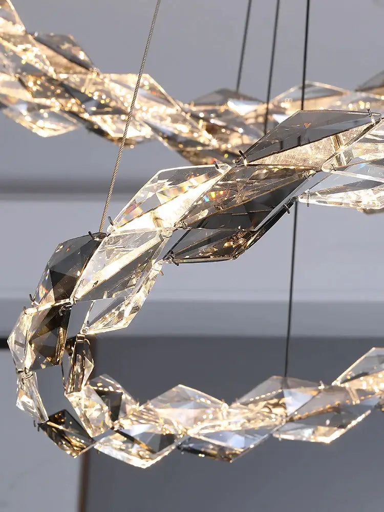 A modern luxury decorbites crystal chandelier with faceted crystal pieces in a spiral design for duplex staircases