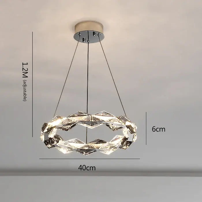 Decorbites crystal chandelier featuring a modern circular design with faceted clear glass rings and chrome mount