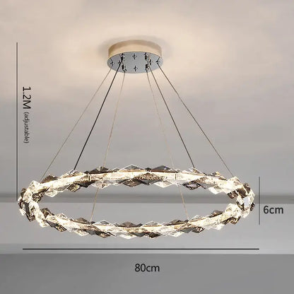 Decorbites crystal chandelier featuring a modern circular design with chrome finish and faceted clear crystal ring