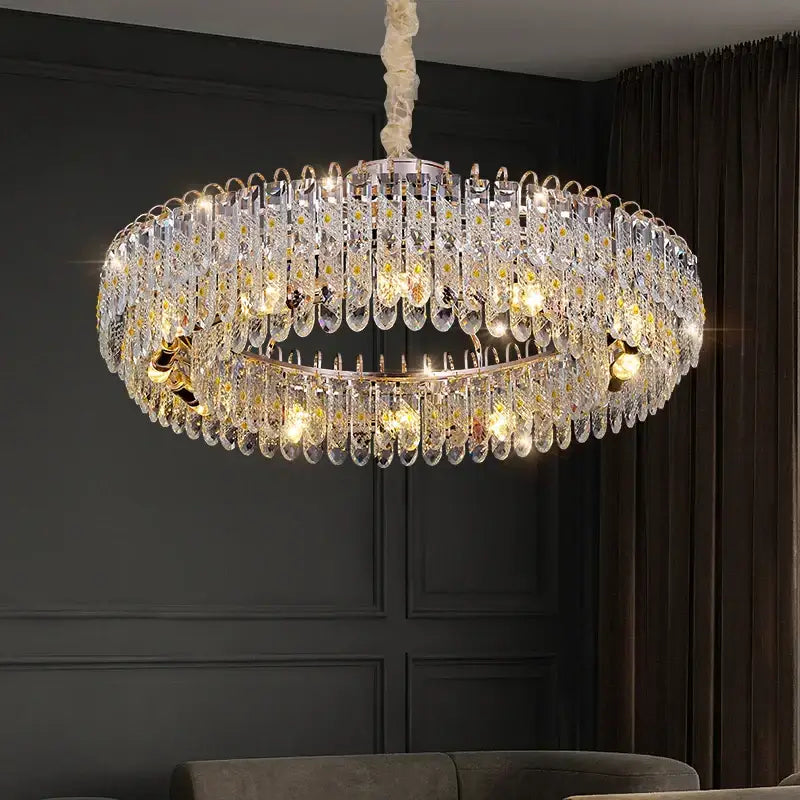 A luxurious decorbites crystal chandelier with clear teardrop crystals and gold-toned accents for modern spaces