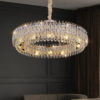 A luxurious gold-toned decorbites crystal chandelier with multiple k9 crystal tiers for modern living spaces