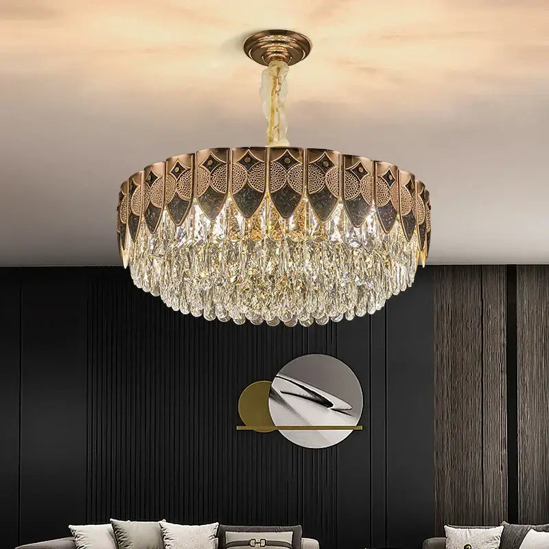 Gold-toned decorbites crystal chandelier with geometric cutouts and cascading clear crystal droplets for modern luxury