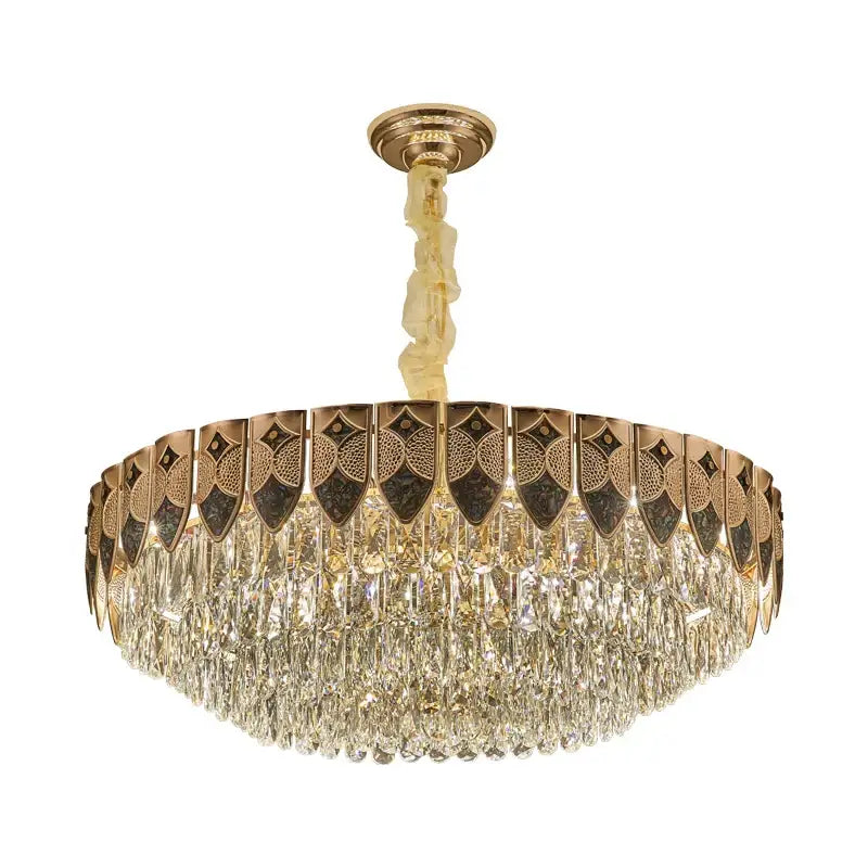 Luxurious gold-toned decorbites crystal chandelier with intricate geometric metalwork and cascading clear crystal droplets for modern luxury