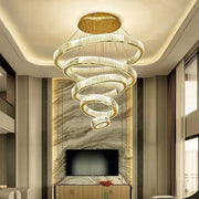Modern spiral crystal chandelier with polished gold rings and clear crystals by decorbites for villa lighting